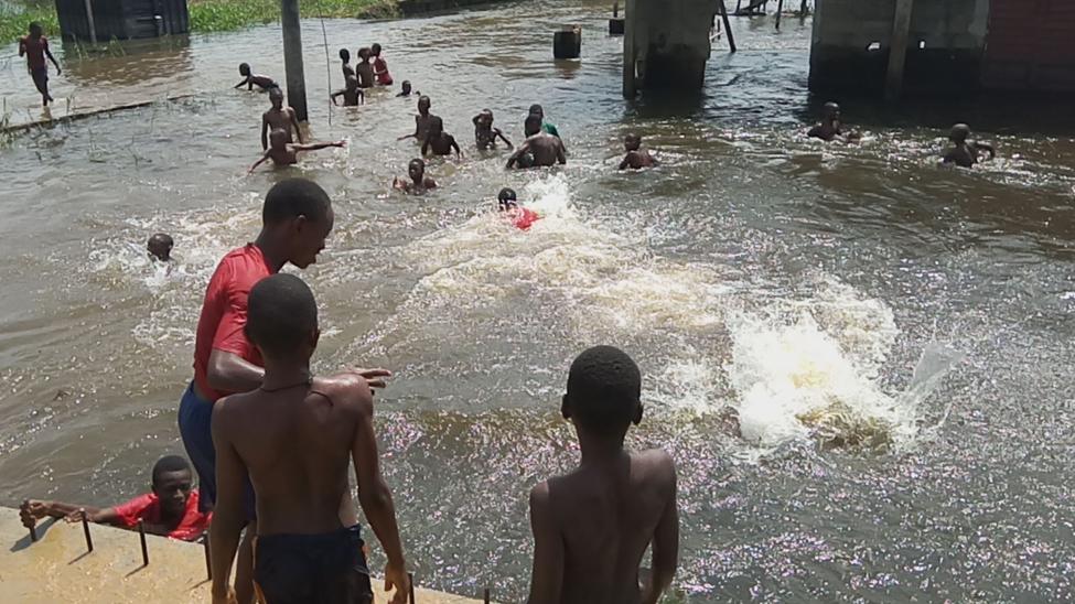 Children bathing and swimming in the flood water in Igbogene Community, Bayelsa State