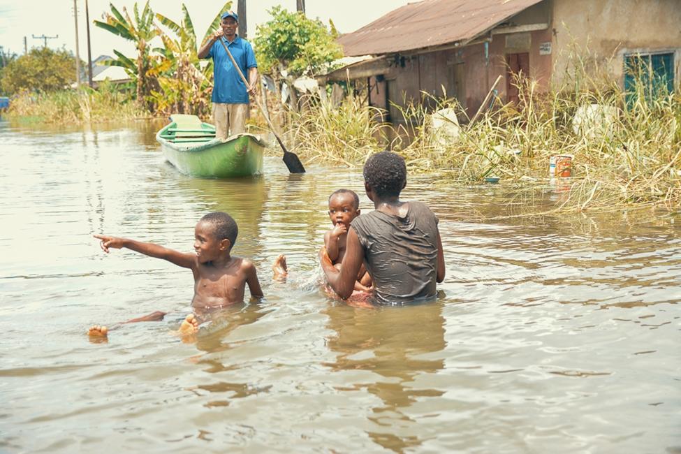 Children bathing in flood waters